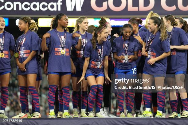 United States players including Alex Morgan and Crystal Dunn celebrate after defeating Brazil during the 2024 Concacaf W Gold Cup final at Snapdragon...