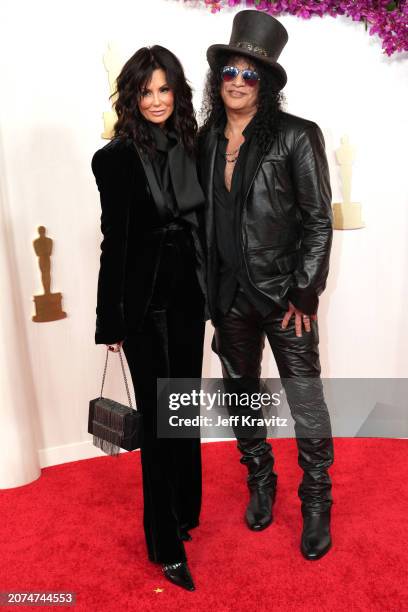 Meegan Hodges and Slash attend the 96th Annual Academy Awards on March 10, 2024 in Hollywood, California.