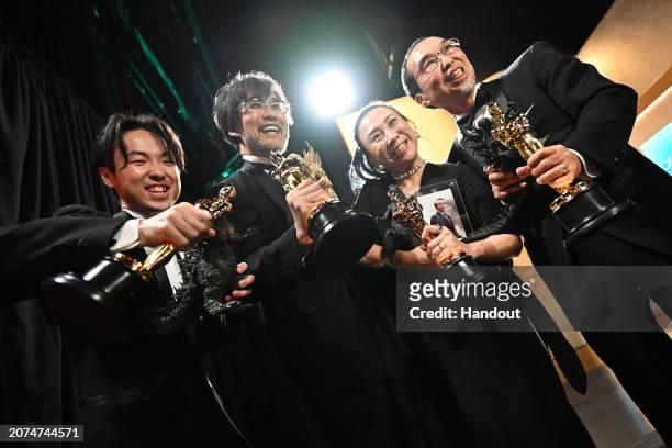 In this handout photo provided by A.M.P.A.S., Tatsuji Nojima, Takashi Yamazaki, Kiyoko Shibuya and Masaki Takahashi are seen backstage during the...