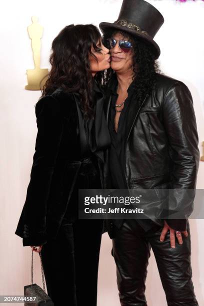 Meegan Hodges and Slash attend the 96th Annual Academy Awards on March 10, 2024 in Hollywood, California.
