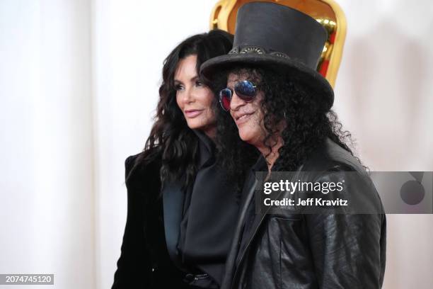 Meegan Hodges and Slash attend the 96th Annual Academy Awards on March 10, 2024 in Hollywood, California.