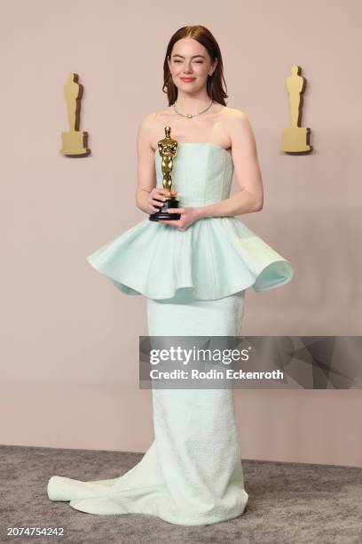Emma Stone, winner of the Best Actress in a Leading Role award for 'Poor Things,' poses in the press room during the 96th Annual Academy Awards at...