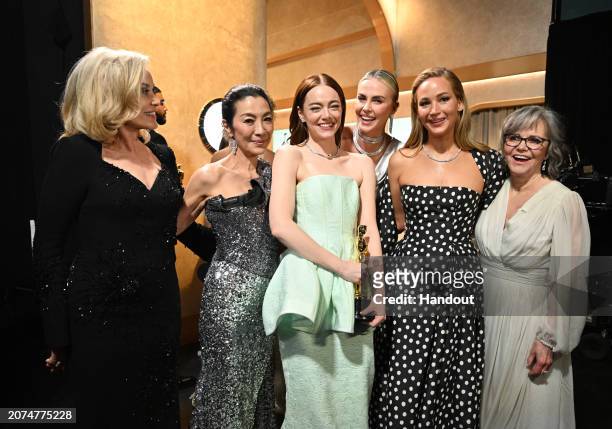 In this handout photo provided by A.M.P.A.S., Jessica Lange, Emma Stone, Jennifer Lawrence, Sally Field and others are seen backstage during the 96th...