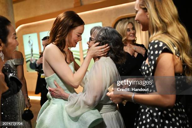 In this handout photo provided by A.M.P.A.S., Michelle Yeoh, Emma Stone, Sally Field and Jennifer Lawrence are seen backstage during the 96th Annual...