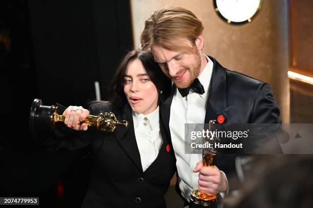 In this handout photo provided by A.M.P.A.S., Billie Eilish and Finneas O’Connell are seen backstage during the 96th Annual Academy Awards at Dolby...