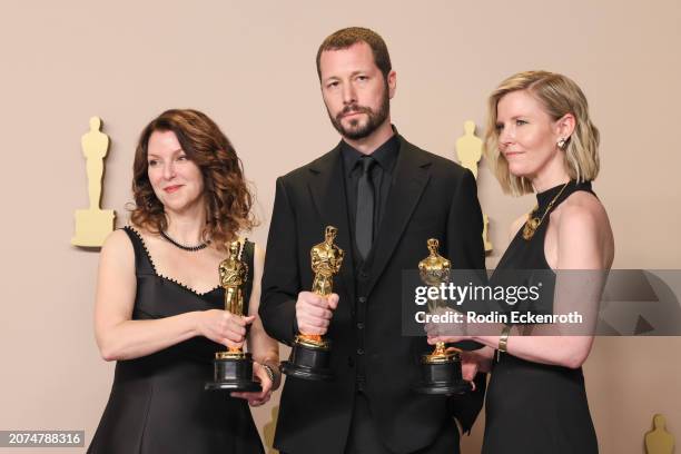 Raney Aronson-Rath, Mstyslav Chernov, and Michelle Mizner, winners of the Best Documentary Feature Film for “20 Days in Mariupol”, pose in the press...
