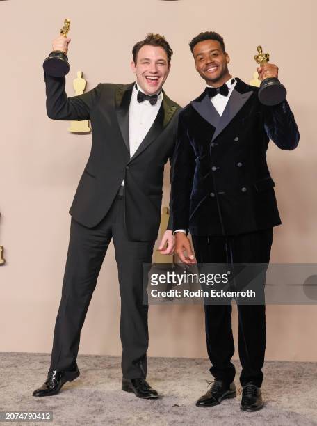 Ben Proudfoot and Kris Bowers, winners of the Best Documentary Short Film award for “The Last Repair Shop”, pose in the press room during the 96th...