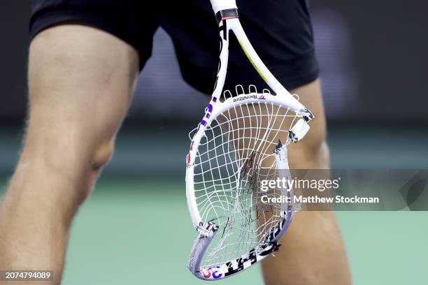 Tallon Griekspoor of Netherlands smashes his racquet after losing the first set to Alexander Zverev of Germany during the BNP Paribas Open at Indian...