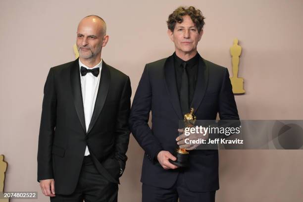 Jonathan Glazer , winner of the Best International Feature Film award for “The Zone of Interest”, poses with James Wilson pose in the press room...