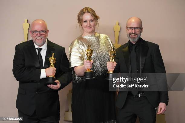 Mark Coulier, Nadia Stacey, and Josh Weston, winners of the Best Makeup and Hairstyling award for “Poor Things”, pose in the press room during the...