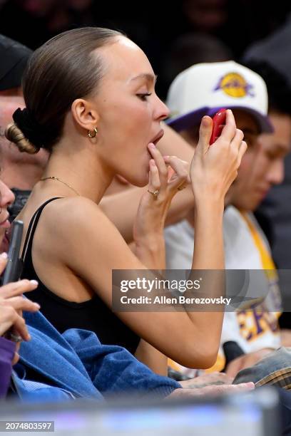 Lily-Rose Depp attends a basketball game between the Los Angeles Lakers and the Minnesota Timberwolves at Crypto.com Arena on March 10, 2024 in Los...