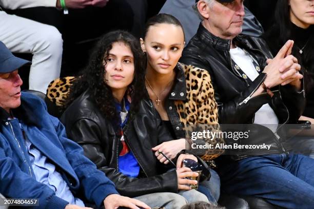 Lily-Rose Depp and musician 070 Shake attend a basketball game between the Los Angeles Lakers and the Minnesota Timberwolves at Crypto.com Arena on...