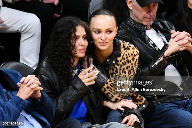 Lily-Rose Depp and musician 070 Shake attend a basketball game between the Los Angeles Lakers and the Minnesota Timberwolves at Crypto.com Arena on...