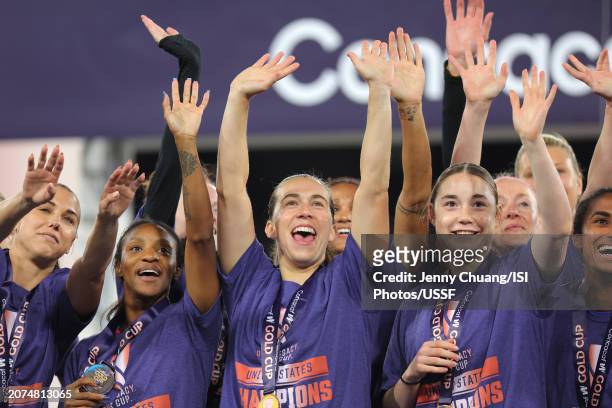 United States players including Alex Morgan, Crystal Dunn, Sam Coffey, and Olivia Moultrie celebrate after defeating Brazil during the 2024 Concacaf...