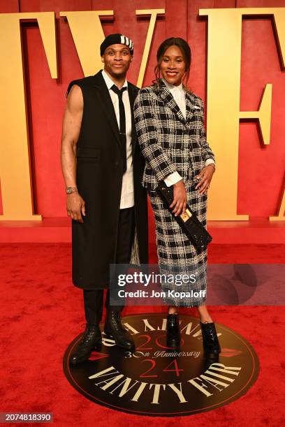 Russell Westbrook and Nina Westbrook attend the 2024 Vanity Fair Oscar Party Hosted By Radhika Jones at Wallis Annenberg Center for the Performing...