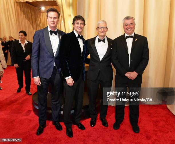 Zack Van Amburg and Jamie Erlicht and CEO of Apple Tim Cook attend the 96th Annual Academy Awards at Dolby Theatre on March 10, 2024 in Hollywood,...