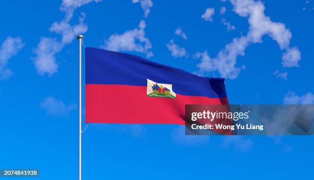 haiti flag with blue sky background - haití fotografías e imágenes de stock