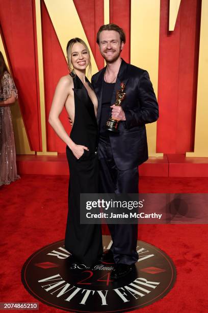 Claudia Sulewski and Finneas O'Connell attend the 2024 Vanity Fair Oscar Party Hosted By Radhika Jones at Wallis Annenberg Center for the Performing...