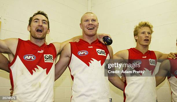 Darren Cresswell, Barry Hall and Craig Bolton of the Swans celebrate after victory in the round 11 AFL match between the Sydney Swans and the...