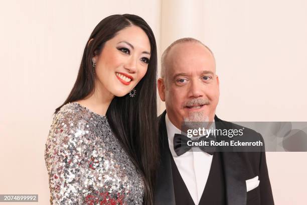 Clara Wong and Paul Giamatti attend the 96th Annual Academy Awards on March 10, 2024 in Hollywood, California.
