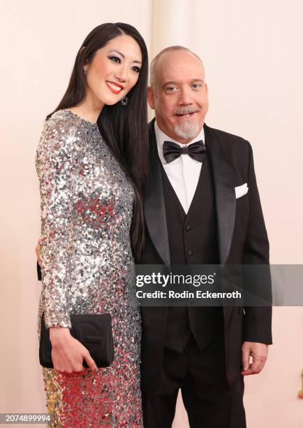 Clara Wong and Paul Giamatti attend the 96th Annual Academy Awards on March 10, 2024 in Hollywood, California.