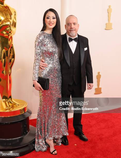 Clara Wong and Paul Giamatti attend the 96th Annual Academy Awards on March 10, 2024 in Hollywood, California.