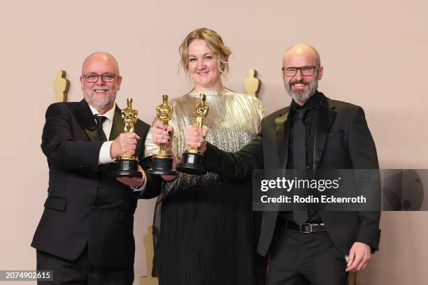 Josh Weston, Nadia Stacey, and Mark Coulier, winners of Makeup and Hairstyling award for 'Poor Things,' pose in the press room during the 96th Annual...