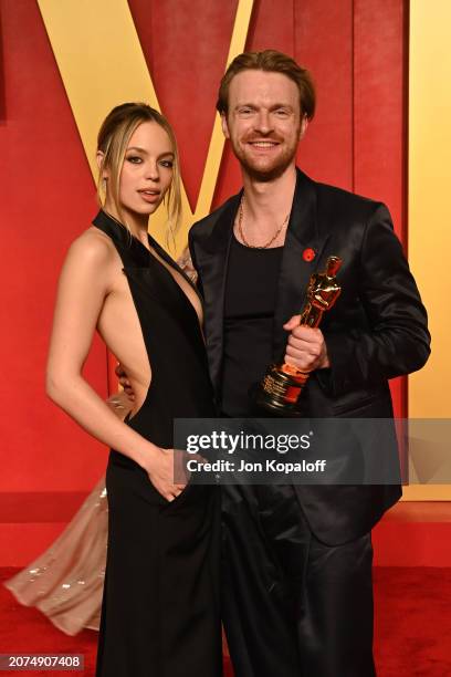 Claudia Sulewski and Finneas O'Connell attend the 2024 Vanity Fair Oscar Party Hosted By Radhika Jones at Wallis Annenberg Center for the Performing...