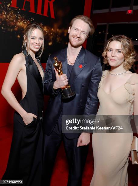 Claudia Sulewski, Finneas O'Connell, and Maggie Rogers attend the 2024 Vanity Fair Oscar Party Hosted By Radhika Jones at Wallis Annenberg Center for...