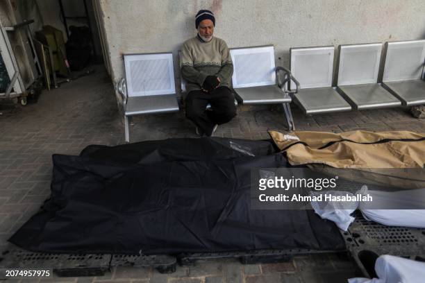 People mourn as they receive the dead bodies of victims of an Israeli strike on March 11, 2024 in Rafah, Gaza. The United States and other nations...