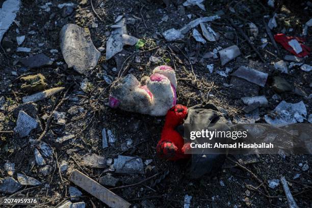 People inspect damage and recover items from their homes following Israeli air strikes on March 11, 2024 in Rafah, Gaza. The United States and other...