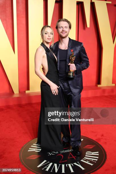 Claudia Sulewski and Finneas O'Connell attend the 2024 Vanity Fair Oscar Party Hosted By Radhika Jones at Wallis Annenberg Center for the Performing...