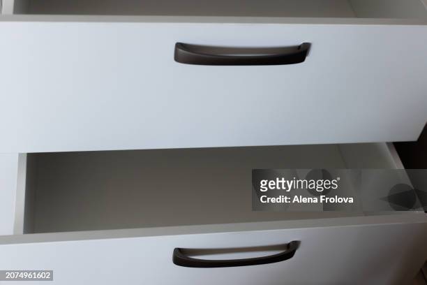 wardrobe with empty shelves in the bedroom concept of a new home cleaning cleanliness conceptual image of empty wooden coat hangers in a closet - collection backstage stock pictures, royalty-free photos & images