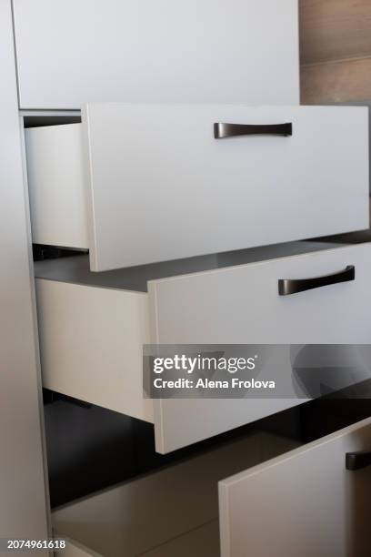 wardrobe with empty shelves in the bedroom concept of a new home cleaning cleanliness conceptual image of empty wooden coat hangers in a closet - collection backstage stock pictures, royalty-free photos & images