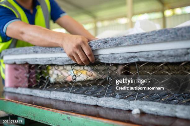production of spring beds - matratzenfeder stock-fotos und bilder