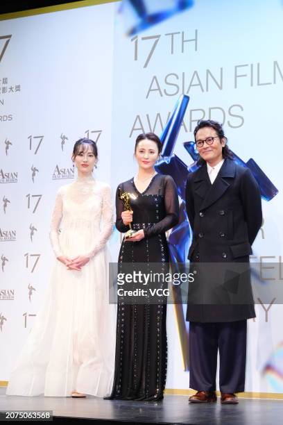 Actress Isabella Leong and actor Gordon Lam Ka-tung present Best Actress award to actress Jiang Qinqin during the 17th Asian Film Awards on March 10,...