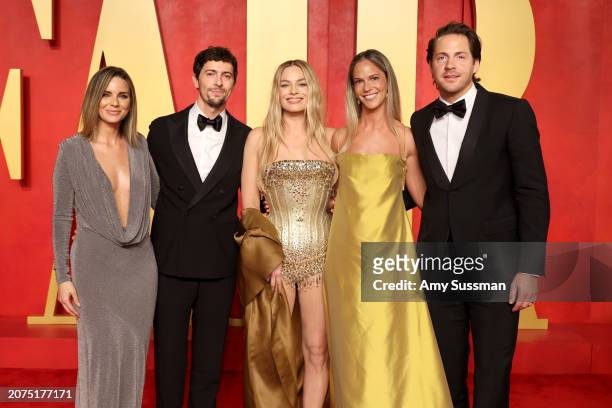 Josey McNamara, Margot Robbie and Tom Ackerley attend the 2024 Vanity Fair Oscar Party Hosted By Radhika Jones at Wallis Annenberg Center for the...