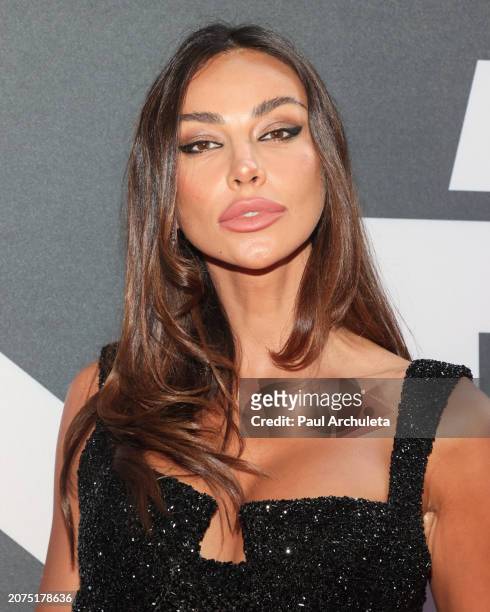Madalina Ghenea attends the Justice For Women International and Children Uniting Nations' 24th Annual Academy Awards Celebration at Warner Bros....