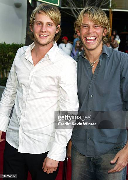 Actors Derek Richardson and Eric Christian Olsen arrive at the premiere of "Dumb and Dumberer: When Harry Met LLoyd" at the Loews Universal City on...