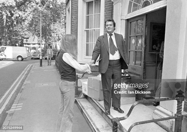 Clifford T Ward greets his new label boss, Charisma's Tony Stratton-Smith, Carlisle Street, Soho, London 1973.
