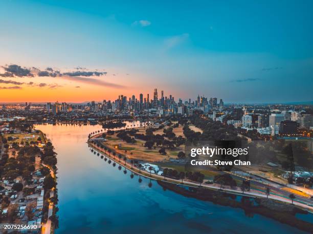 aerial view of albert park during dusk - melbourne racing stock pictures, royalty-free photos & images