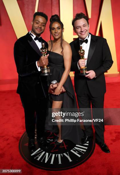 Kris Bowers, Briana Henry, and Ben Proudfoot attend the 2024 Vanity Fair Oscar Party Hosted By Radhika Jones at Wallis Annenberg Center for the...