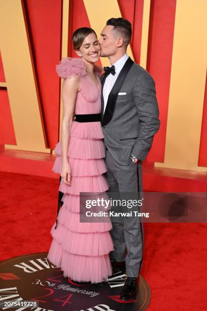 Allison Williams and Alexander Dreymon attend the 2024 Vanity Fair Oscar Party hosted by Radhika Jones at Wallis Annenberg Center for the Performing...