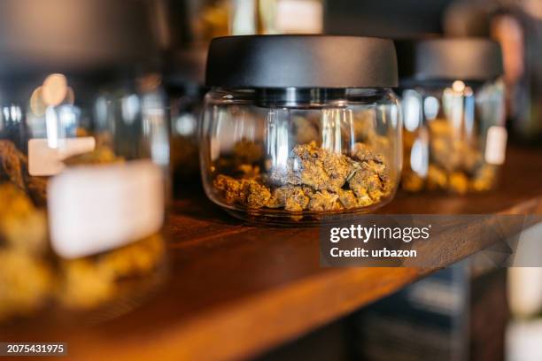 herbal cannabis in a jar in a cannabis shop in thailand - stampot stockfoto's en -beelden
