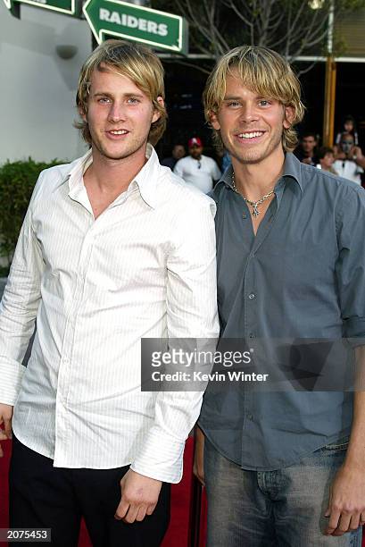 Actors Derek Richardson and Eric Christian Olsen arrive at the premiere of "Dumb and Dumberer: When Harry Met Lloyd" at the Loews Universal City on...