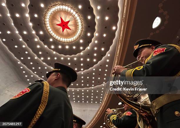 Members of the Peoples Liberation Army Band play at the closing session of the NPC, or National Peoples Congress at the Great Hall of the People on...