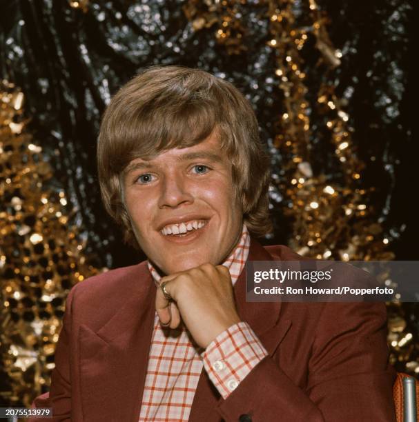 English singer and actor Peter Noone, lead vocalist with pop group Herman's Hermits, posed backstage in London circa 1968.