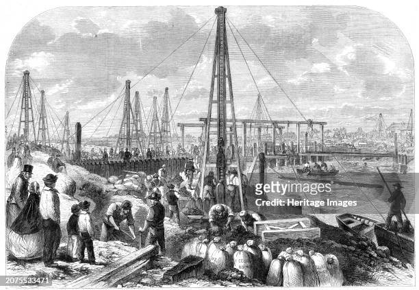 The Flood in the Fens: making the cofferdam, 1862. 'The hopes, mingled largely with fears, of the Marshland farmers are centred upon the gigantic...