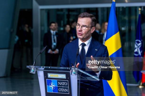 Swedish Prime Minister Ulf Kristersson gives a press conference before the flag-raising ceremony to mark Sweden's accession to NATO at the NATO...