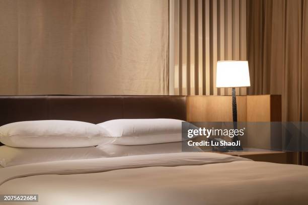 comfortable bed in hotel. - hotel room stock-fotos und bilder
